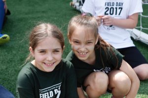 Two students smiling together on Field Day