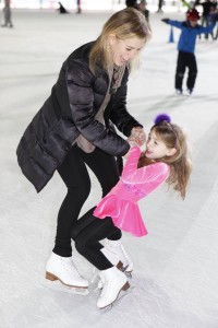 Parent iceskating with their child at the PA's Skate Night