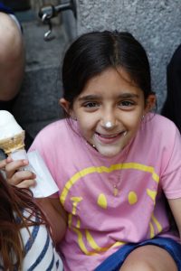 Student happily eating an ice cream cone