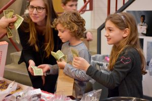 Students paying at a Bake Sale