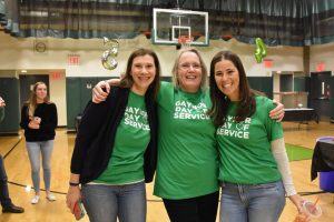 Three staff members posing together on Gaynor Day of Service