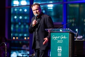 Comedian Colin Quinn gestures emphatically during his comedy set.