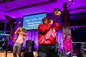 The Preservation Hall Jazz Band plays on stage. 