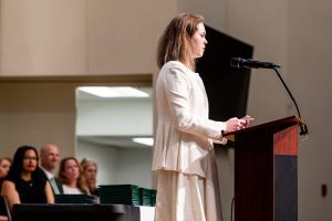 Alumni speaker Zoe Vorisek presenting her speech.