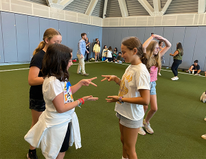 Two students playing rock-paper-scissors