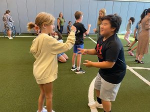 Two students playing rock-paper-scissors