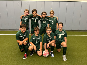 Gaynor soccer team with 7 players posing together