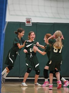 Gaynor volleyball players celebrate on the court