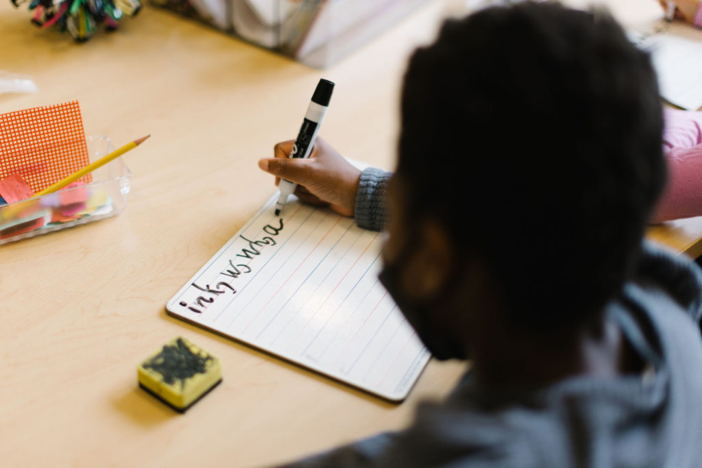 A student practicing writing