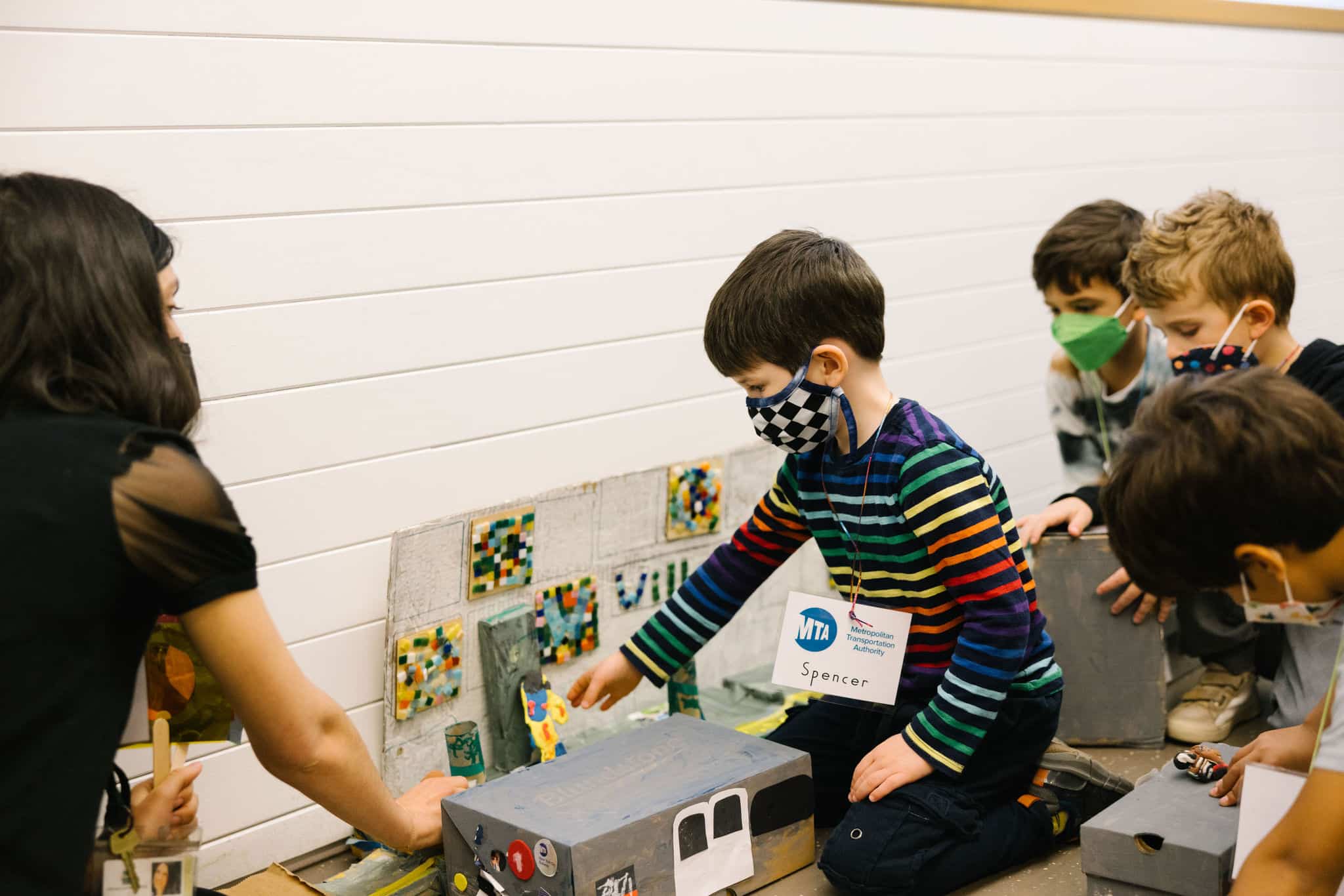 Students interact with displays about the subway system.