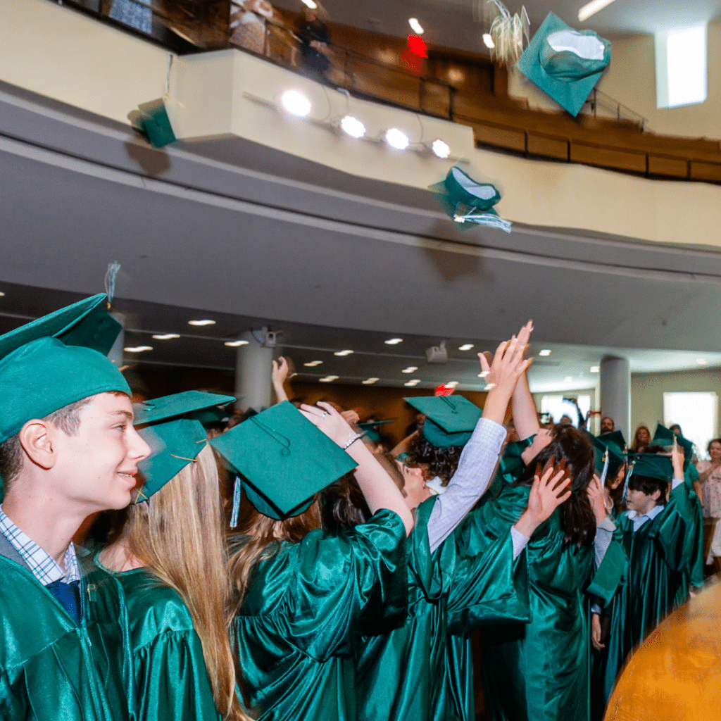 Graduation caps tossed in the air