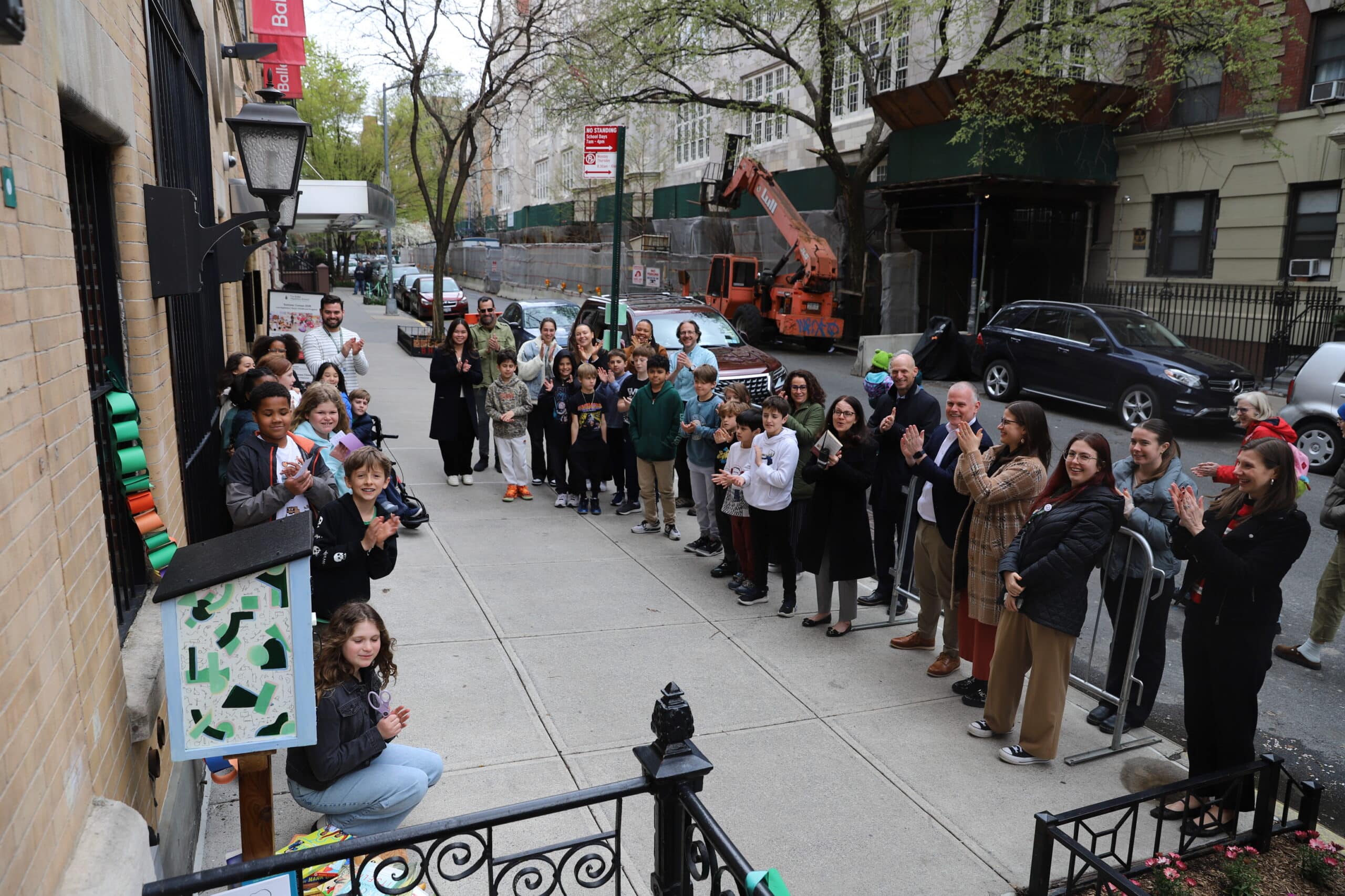 Celebrating the addition of the Little Free Library -- a new community resource!